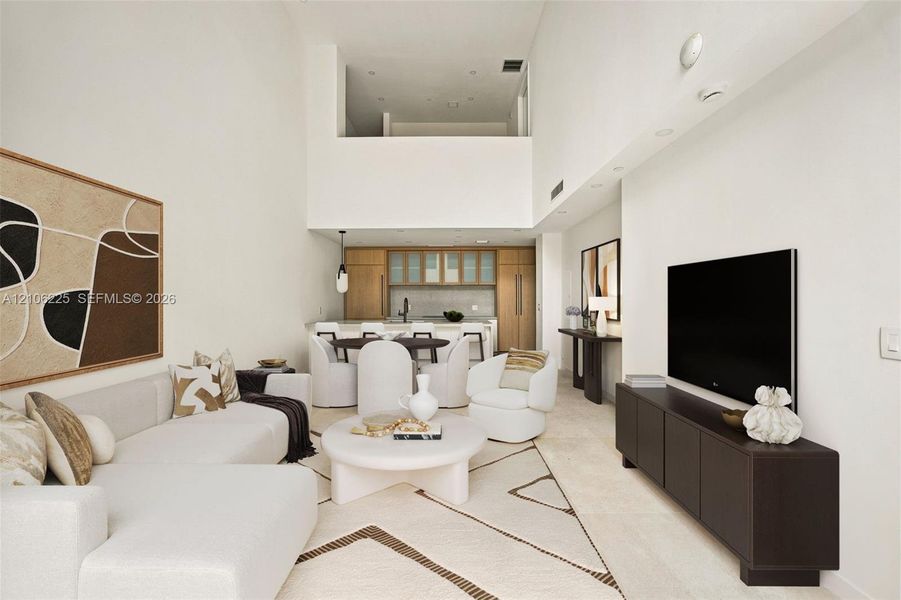 Double-height ceilings, recessed lighting, stone-finish flooring, custom wood-finish cabinetry, and a kitchen island with stone-finish countertops Double-height ceilings, recessed lighting, stone-finish flooring, custom wood-finish cabinetry, and a kitchen island with stone-finish countertops