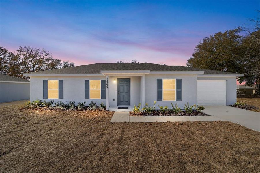 Front exterior of a new home in , Belleview, FL, highlighting curb appeal (Image 22).