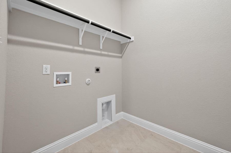 Laundry area featuring hookup for a gas dryer, hookup for an electric dryer, and hookup for a washing machine