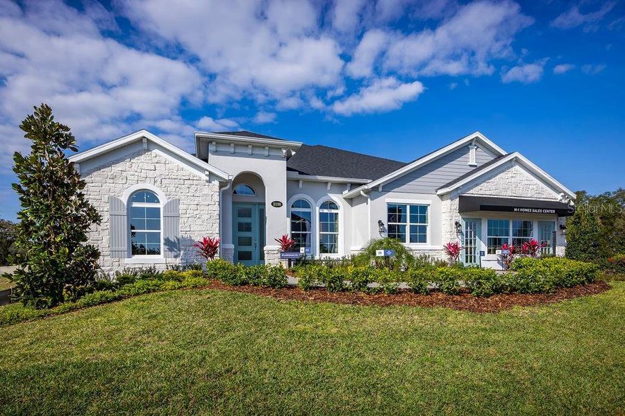 Front exterior of a new home in Wolf Lake Ranch, Apopka, FL, highlighting curb appeal (Image 1).