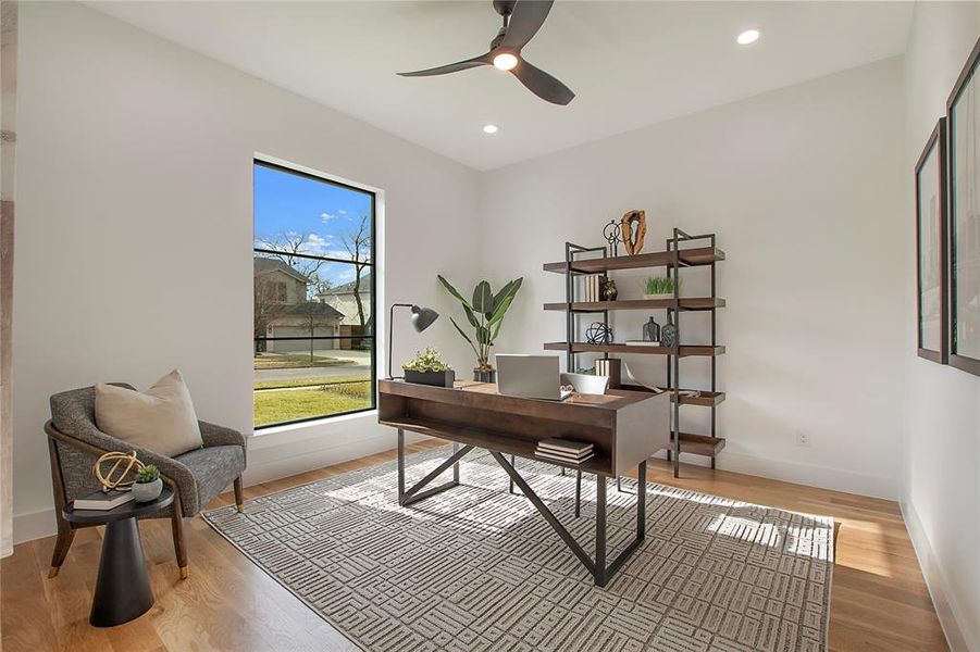 Office with ceiling fan and light hardwood / wood-style floors