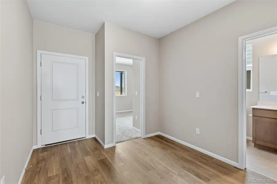 Spacious, unfurnished interior of a new home in The Cottages Collection at Ridgeline Vista, Brighton (Image 12).