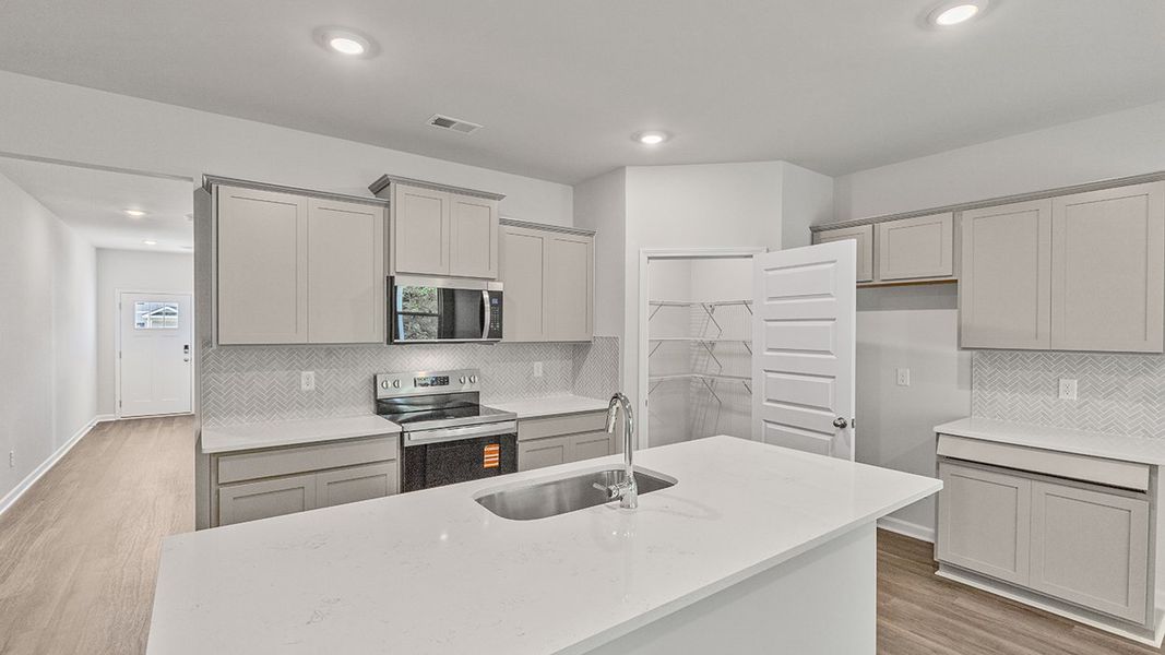 Representative furnished interior of a home built from the Celia by D.R. Horton in Teamon Pointe, Griffin (Image 7).