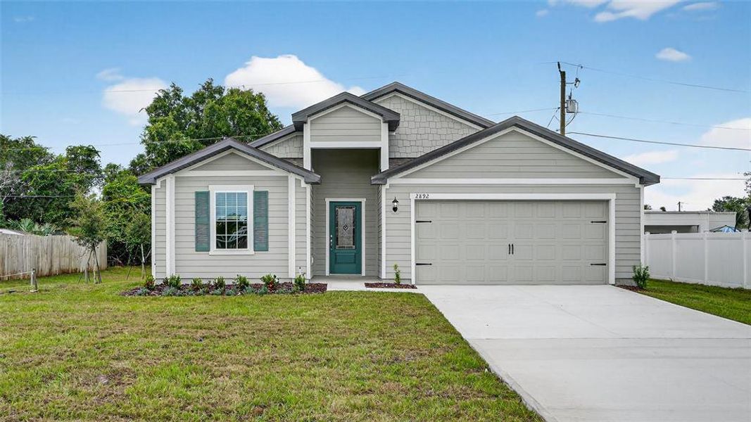 Front exterior of a new home in , Deltona, FL, highlighting curb appeal (Image 1).