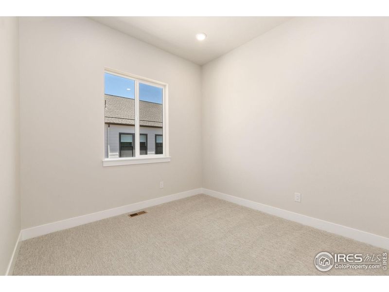 Spacious, unfurnished interior of a new home in Festival at RainDance, Windsor (Image 10).