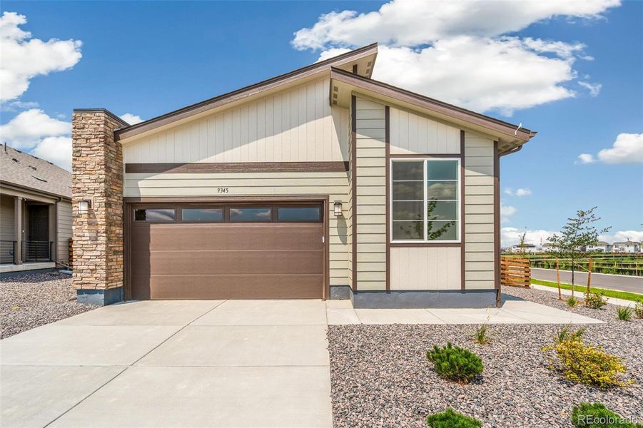 Front exterior of a new home in Legato, Commerce City, CO, highlighting curb appeal (Image 23).