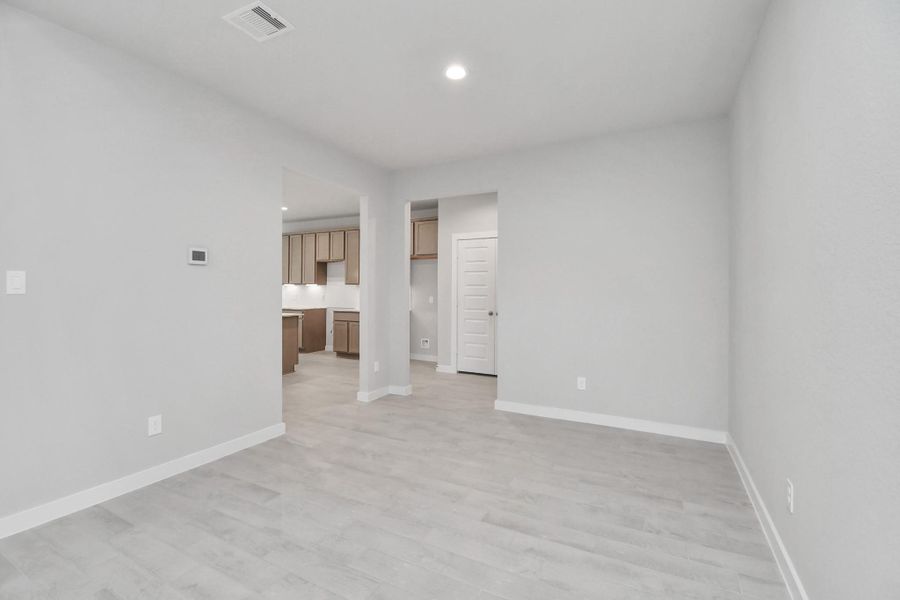 Make memories gathered around the table with your family and friends! This spacious dining room features elegant flooring, custom paint, and adjacent to family room and kitchen for open concept feel. Sample photo of completed home with similar floor plan. Actual colors and selections may vary. Make memories gathered around the table with your family and friends! This spacious dining room features elegant flooring, custom paint, and adjacent to family room and kitchen for open concept feel. Sample photo of completed home with similar floor plan. Actual colors and selections may vary.