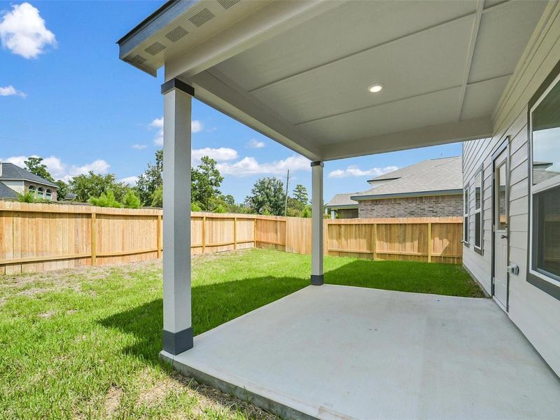 Exterior details and patio area of a home in Lakes at Black Oak, Magnolia (Image 22). Exterior details and patio area of a home in Lakes at Black Oak, Magnolia (Image 22).