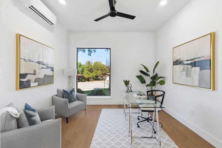 Downstairs office area featuring recessed lighting, light wood-type flooring, and a ceiling fan
