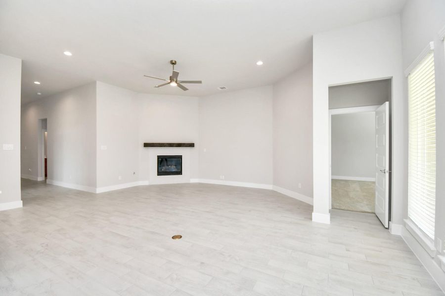 Take another glimpse into the heart of the home with this additional view of the family room—a sprawling space ready to accommodate all your gatherings. Take another glimpse into the heart of the home with this additional view of the family room—a sprawling space ready to accommodate all your gatherings.