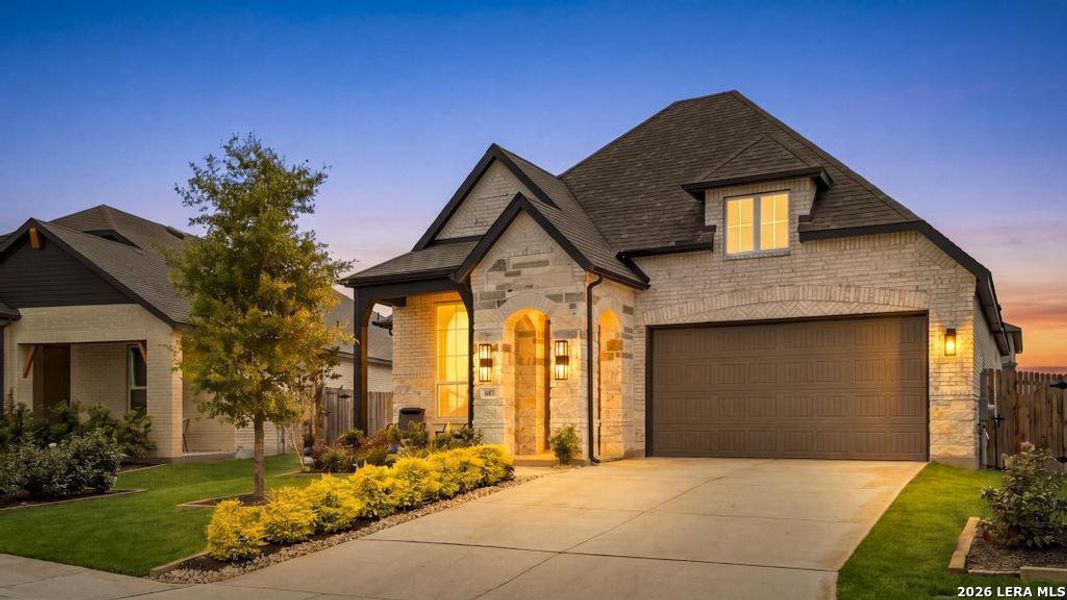 Front exterior of a new home in Alsatian Oaks, Castroville, TX, highlighting curb appeal (Image 20). Front exterior of a new home in Alsatian Oaks, Castroville, TX, highlighting curb appeal (Image 20).