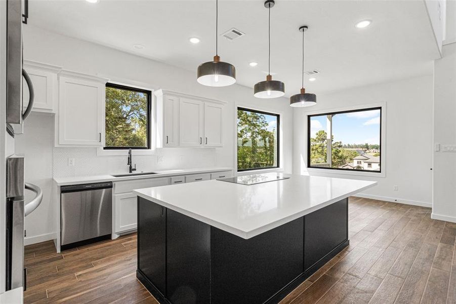 Kitchen has quartz countertops