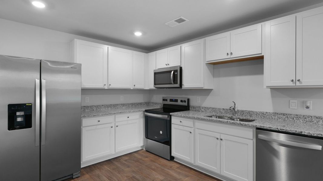 Representative furnished interior of a home built from the SULLIVAN by D.R. Horton in Evergreen, Holly Hill (Image 5).