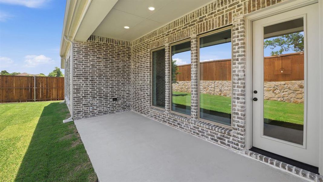 Exterior details and patio area of a home in The Heights at Uptown Celina, Celina (Image 2).