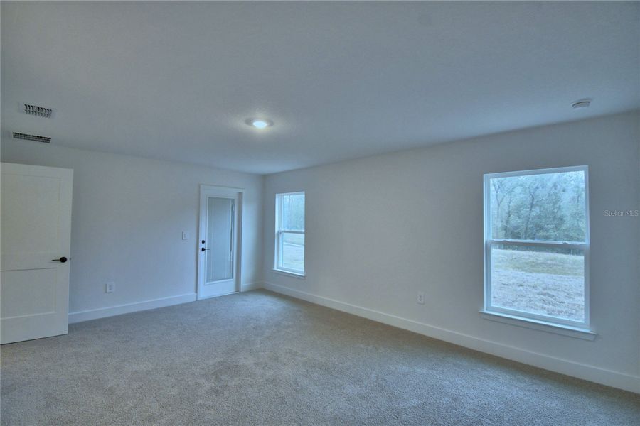 Spacious, unfurnished interior of a new home in Cadence Crossing, Auburndale (Image 35).
