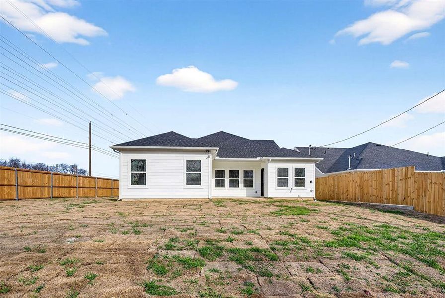 Back of house featuring a patio area and a fenced backyard