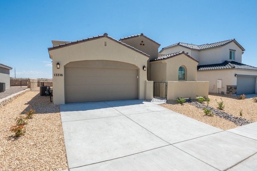Front exterior of a new home in Emerald Estates, El Paso, TX, highlighting curb appeal (Image 18).