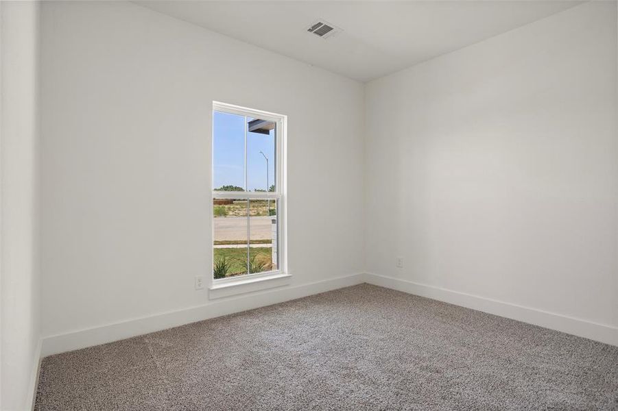 Empty room with carpet floors