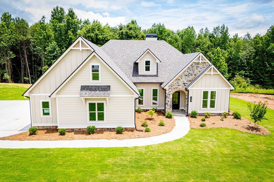 Front exterior of a new home in WOODMONT RESERVE, Roopville, GA, highlighting curb appeal (Image 27).