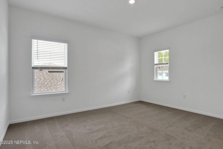 Spacious, unfurnished interior of a new home in TrailMark, St. Augustine (Image 31).