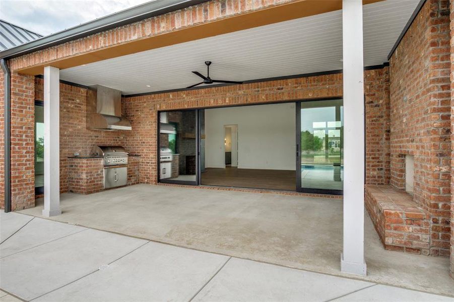 View of patio / terrace featuring grilling area, a ceiling fan, and area for grilling