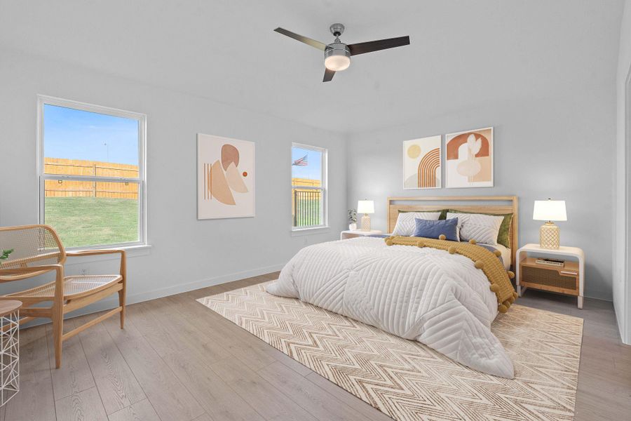 Bedroom with wood finished floors and ceiling fan