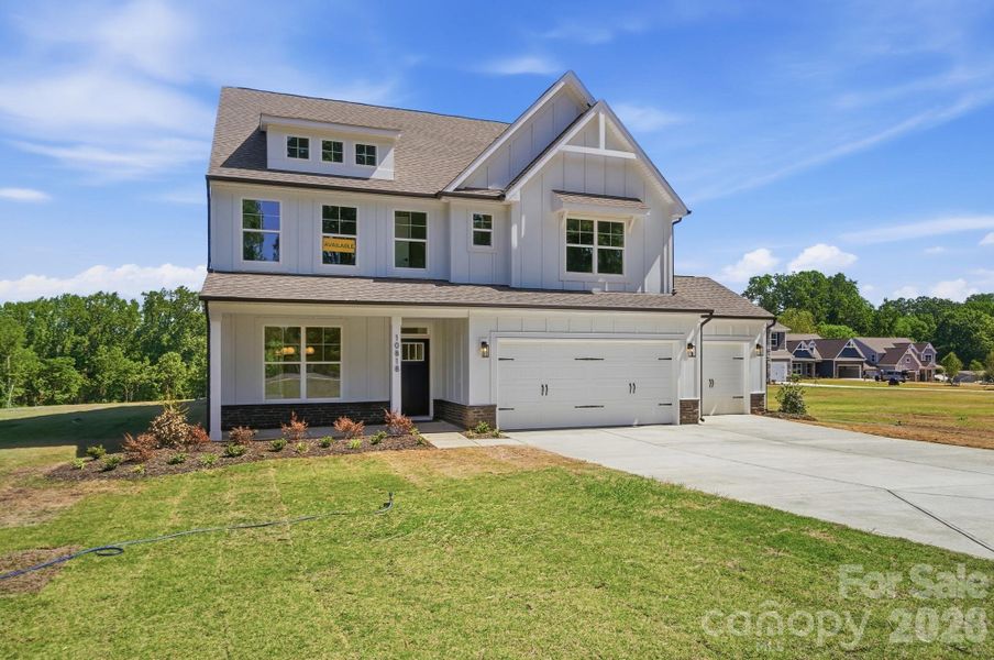Front exterior of a new home in Chasewood, Mint Hill, NC, highlighting curb appeal (Image 2).