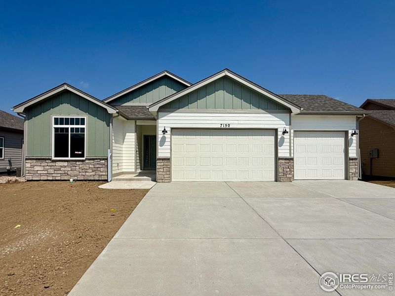Front exterior of a new home in , Wellington, CO, highlighting curb appeal (Image 1). Front exterior of a new home in , Wellington, CO, highlighting curb appeal (Image 1).