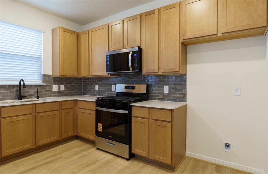 Furnished interior view inside a new home in Oakwood Trails, Tomball (Image 7).