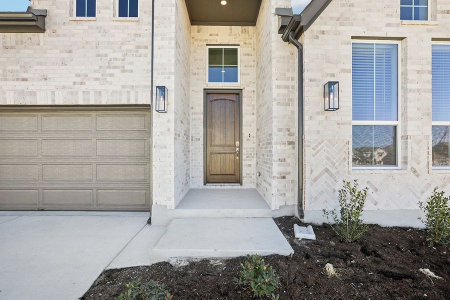 Exterior details and patio area of a home in Sunfield, Buda (Image 18).