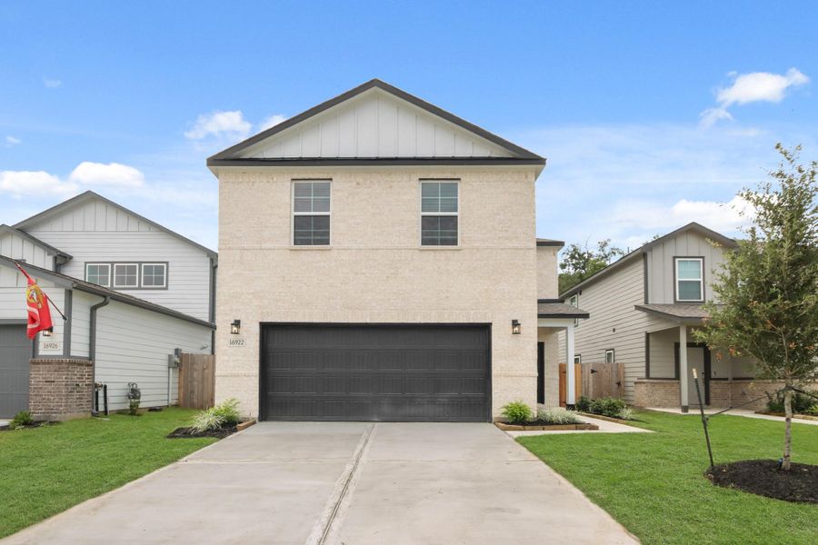 Front exterior of a new home in Lonestar Collection at Granger Pines, Conroe, TX, highlighting curb appeal (Image 2). Front exterior of a new home in Lonestar Collection at Granger Pines, Conroe, TX, highlighting curb appeal (Image 2).