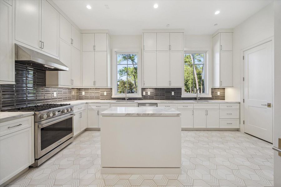 The caterer’s kitchen also includes a secondary washer/dryer hookup and a dedicated closet with hanging space, adding efficiency and convenience.