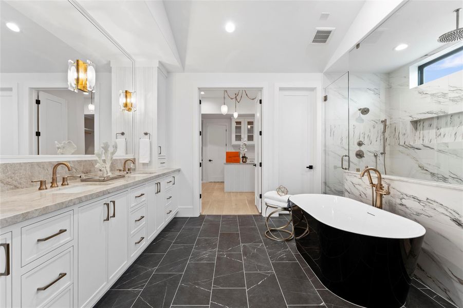 Freestanding tub with designer light.