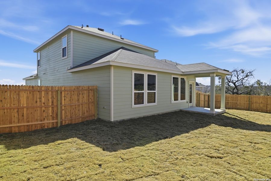 Exterior details and patio area of a home in Fairway Crossing, Converse (Image 15).