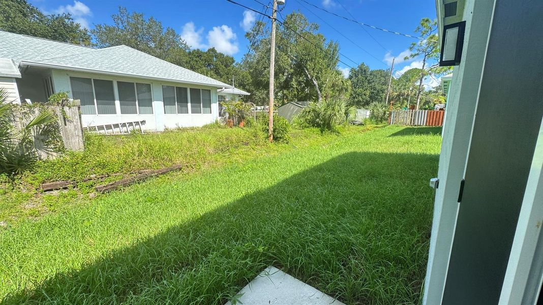Front exterior of a new home in , Vero Beach, FL, highlighting curb appeal (Image 2).