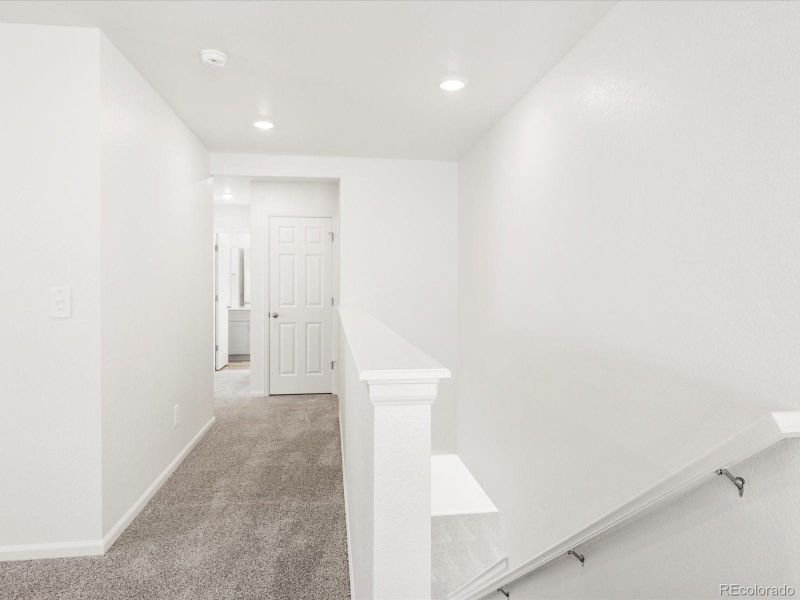 Spacious, unfurnished interior of a new home in Ridgeline Vista: The Flora Collection, Brighton (Image 14).