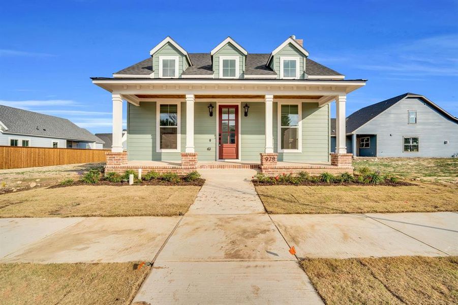 Front exterior of a new home in , Midlothian, TX, highlighting curb appeal (Image 1).