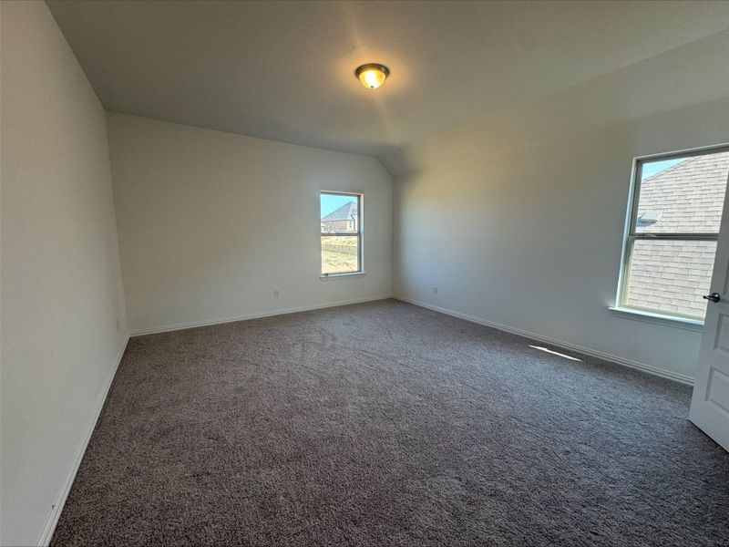 Empty room with carpet floors