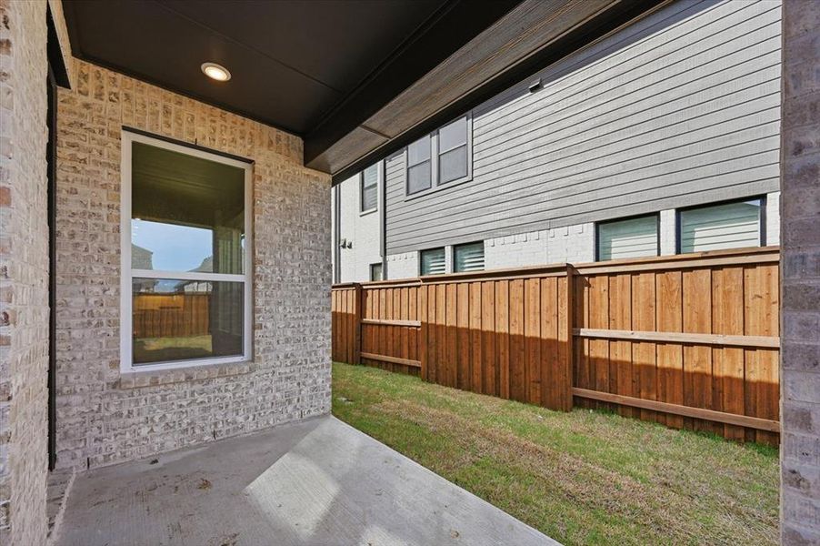 Exterior details and patio area of a home in Mantua Point, Van Alstyne (Image 2).
