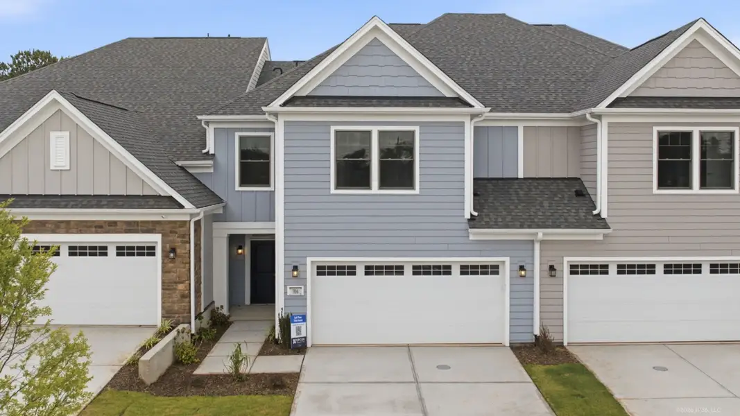 Front exterior of a new home in The Courtyards at Oak Grove, Durham, NC, highlighting curb appeal (Image 2).