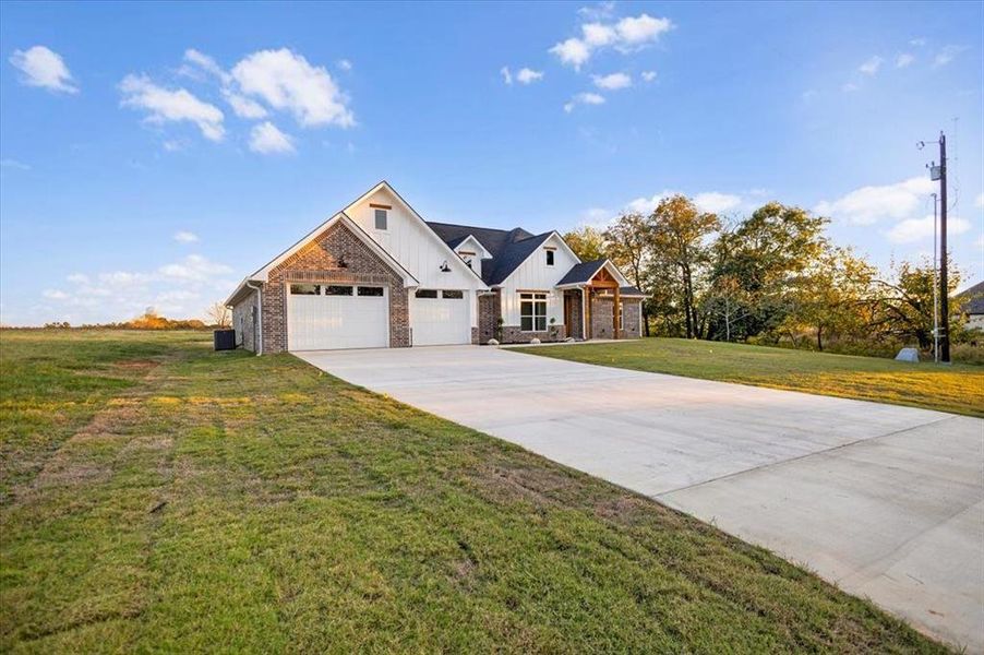 Front exterior of a new home in , Lindale, TX, highlighting curb appeal (Image 22). Front exterior of a new home in , Lindale, TX, highlighting curb appeal (Image 22).