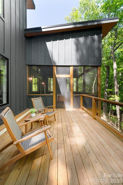 Open deck can be accessed through the primary bedroom or the screened-in porch