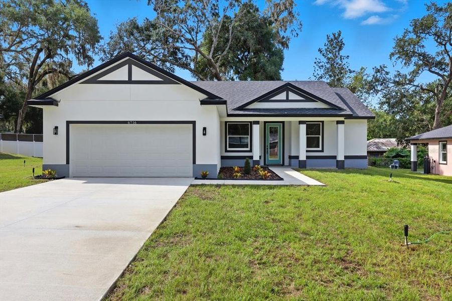 Front exterior of a new home in , Inverness, FL, highlighting curb appeal (Image 20).