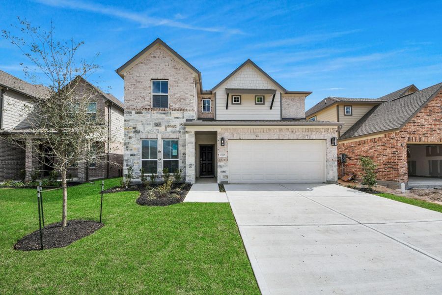 The residence features a practical 2-car garage complemented by a generous driveway, ensuring abundant space for parking needs. The residence features a practical 2-car garage complemented by a generous driveway, ensuring abundant space for parking needs.