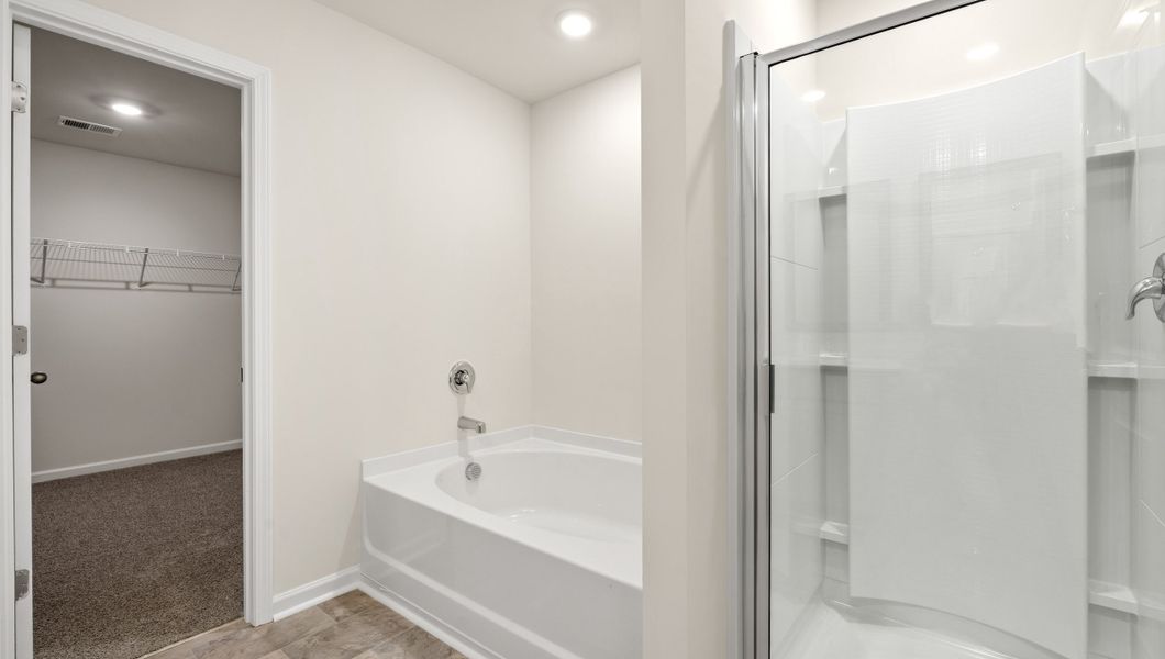 Representative furnished interior of a home built from the WILMINGTON by D.R. Horton in Benjamin's Grove, Woodruff (Image 14).