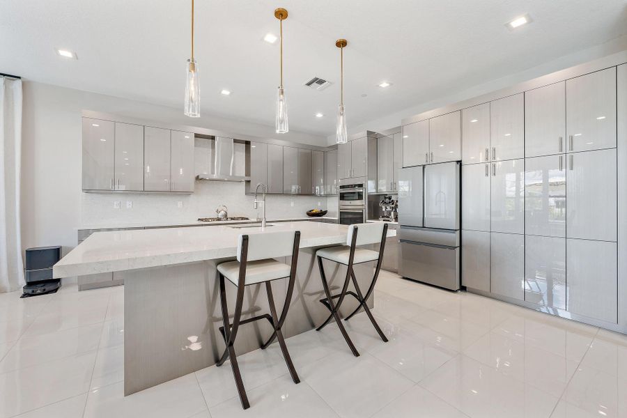 Complete with a gas range, high-end appliances, and upgraded finishes.