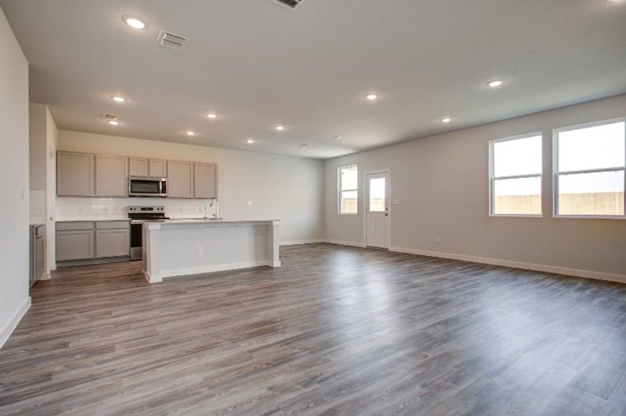 A large empty kitchen. A large empty kitchen.