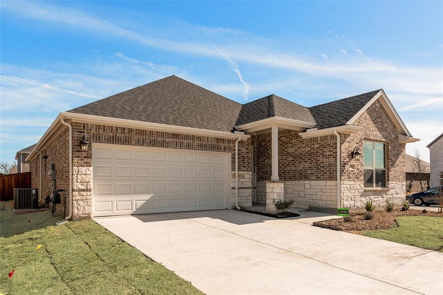 Front exterior of a new home in Walden Pond, Forney, TX, highlighting curb appeal (Image 16). Front exterior of a new home in Walden Pond, Forney, TX, highlighting curb appeal (Image 16).