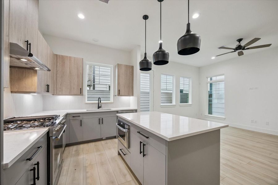 Modern kitchen with open sightlines and abundant counter space Modern kitchen with open sightlines and abundant counter space