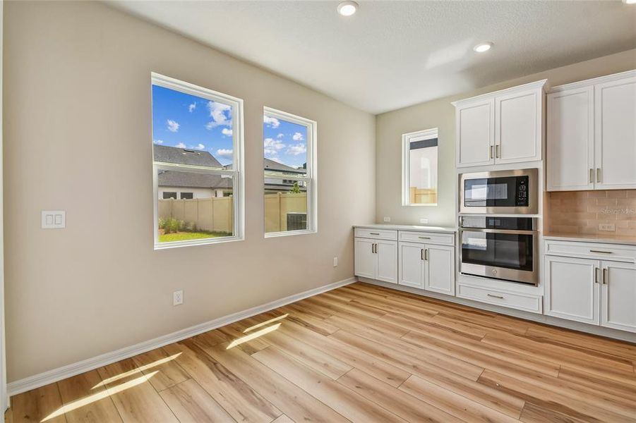 Spacious, unfurnished interior of a new home in Oakfield at Mount Dora Cottage Series, Mount Dora (Image 16).